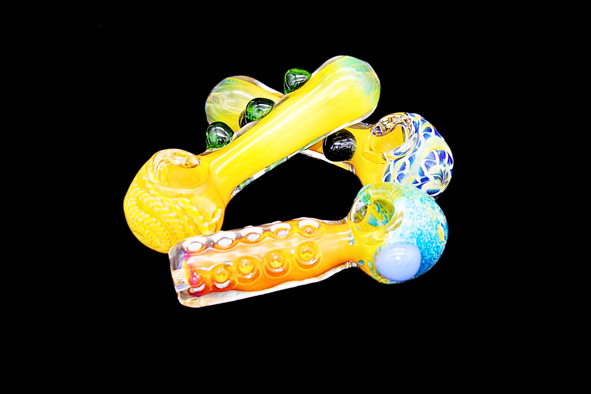 Image of glass pipes in various colors arranged in a triangle | Outer Limits 716